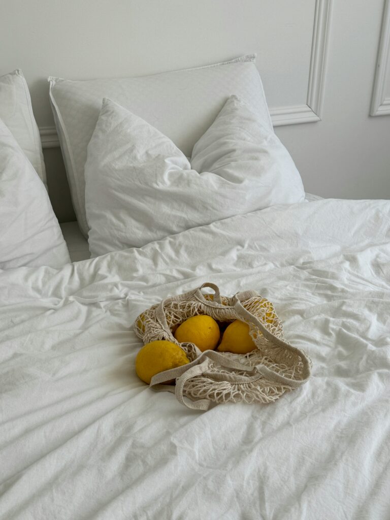 Bag of Lemons on the Bed
