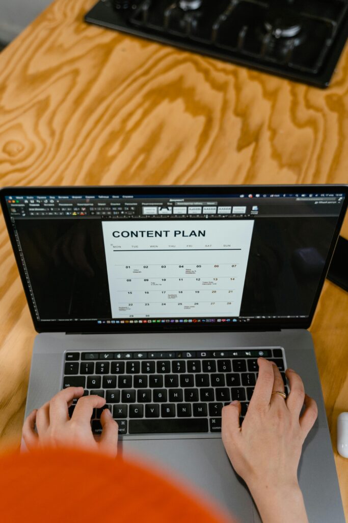 A Person Typing on a Laptop