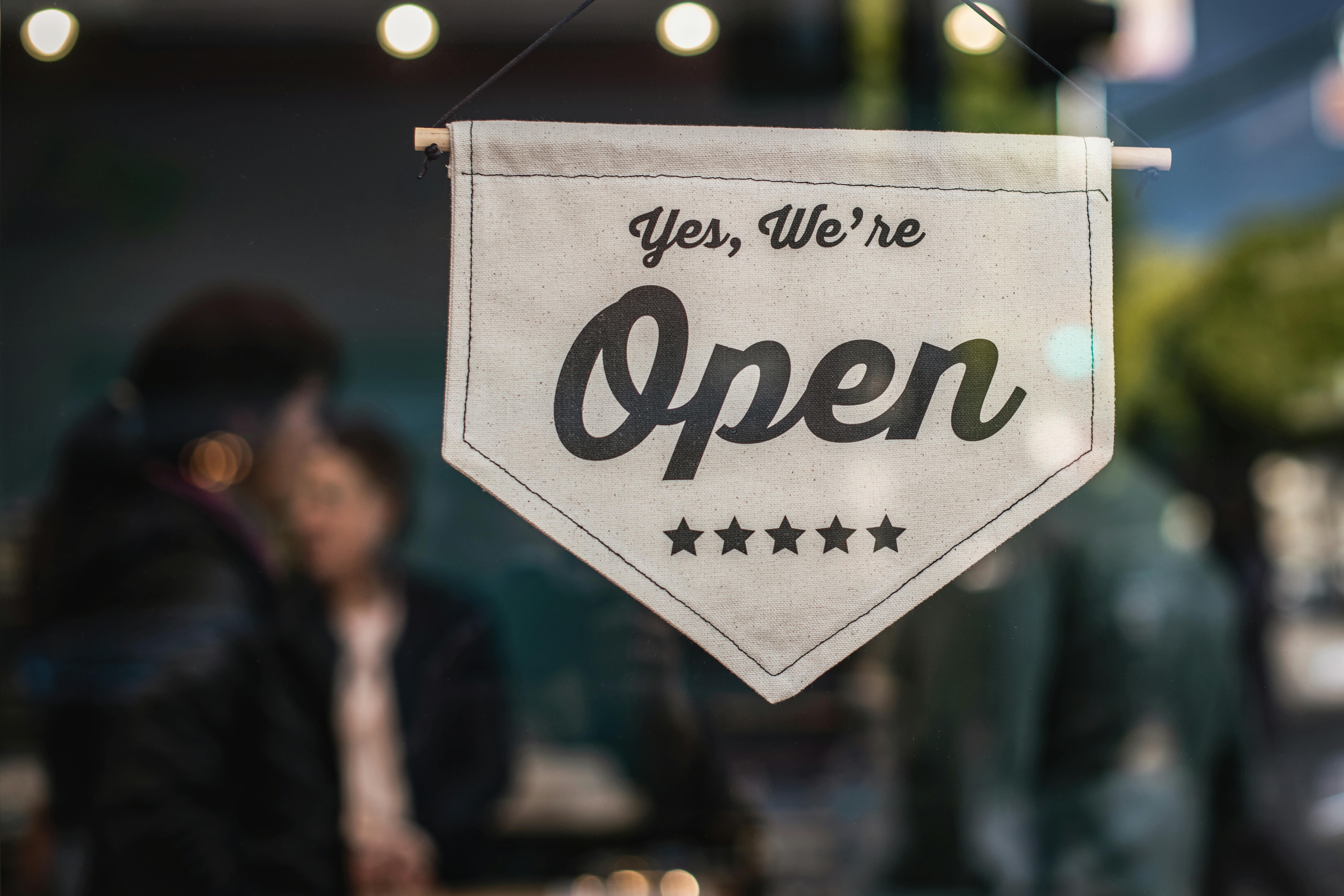 Shallow Focus Photo of "We are open"